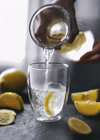 pouring lemon water